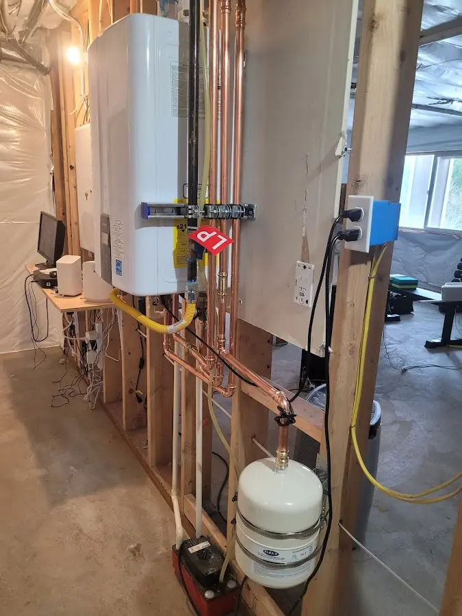 Licensed plumber repairing a kitchen sink in Wind Gap